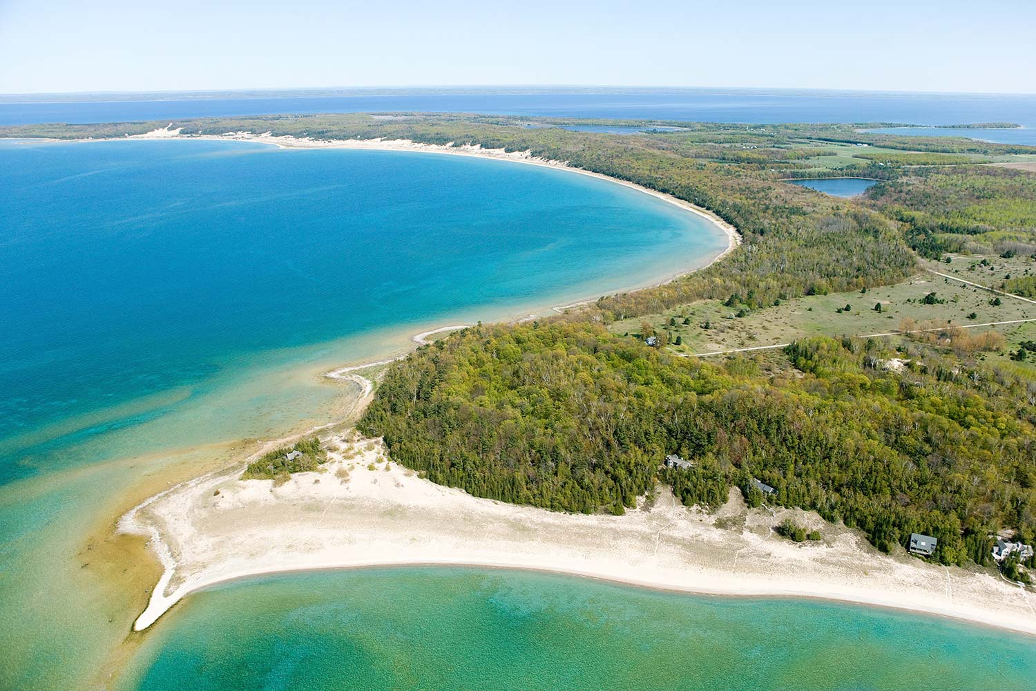Cathead Point | a case study of how earth asset’s due diligence enhances land-based wealth - this 100 acre conserved lake michigan estate owned by melissa’s family for 30+ years was sold by earth asset in under 1 year for a record-setting price to a conservation buyer   