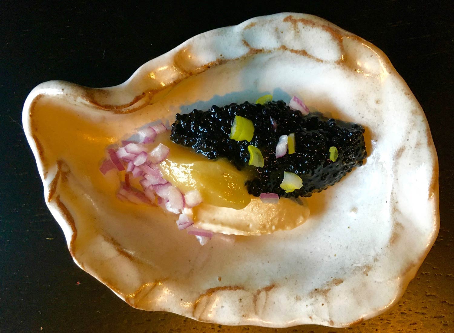 Food Lab at SHO: vegan gastronomy in a cold climate | vegan caviar (made by caviart, kelp-based) with pine nut crème fraîche, preserved lemon puree & red onions served in a ceramic oyster shell